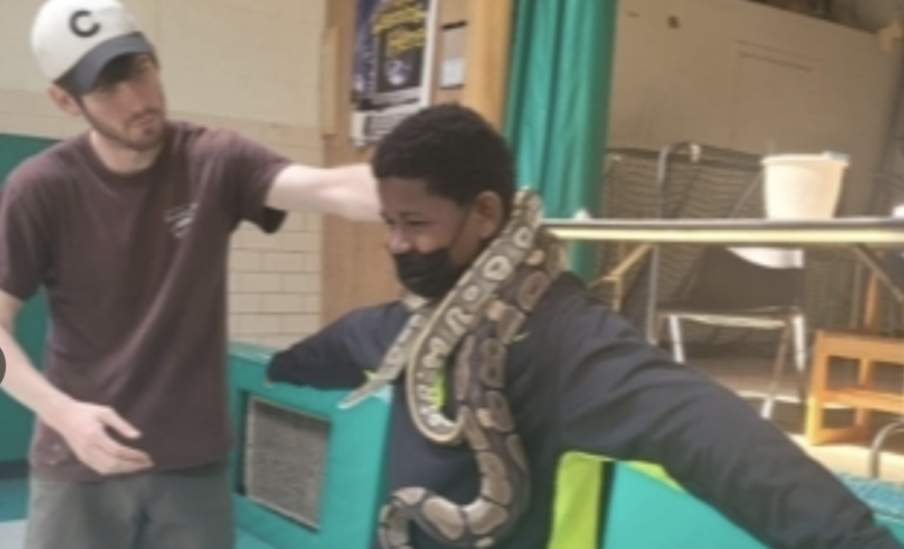 Student with Snake around his neck