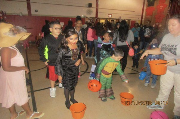Grant School students dressed up in their Halloween costumes searching for candy.