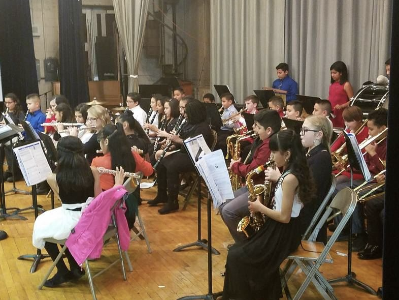 students playing instruments in symphony band